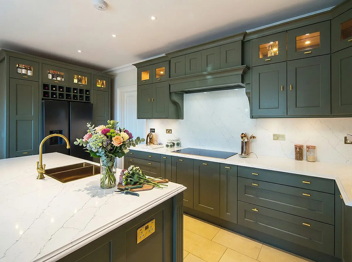 Luxury kitchen in willow with gold handles, taps and sink