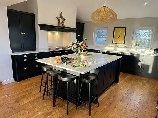Beautiful bespoke kitchen in Farrow and Ball Pitch Black with seating for four at the island
