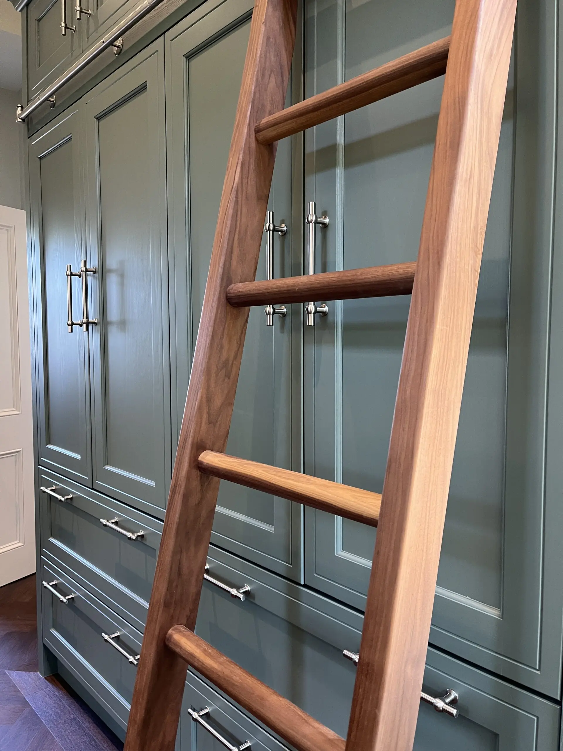 walnut library ladders in ths utility room