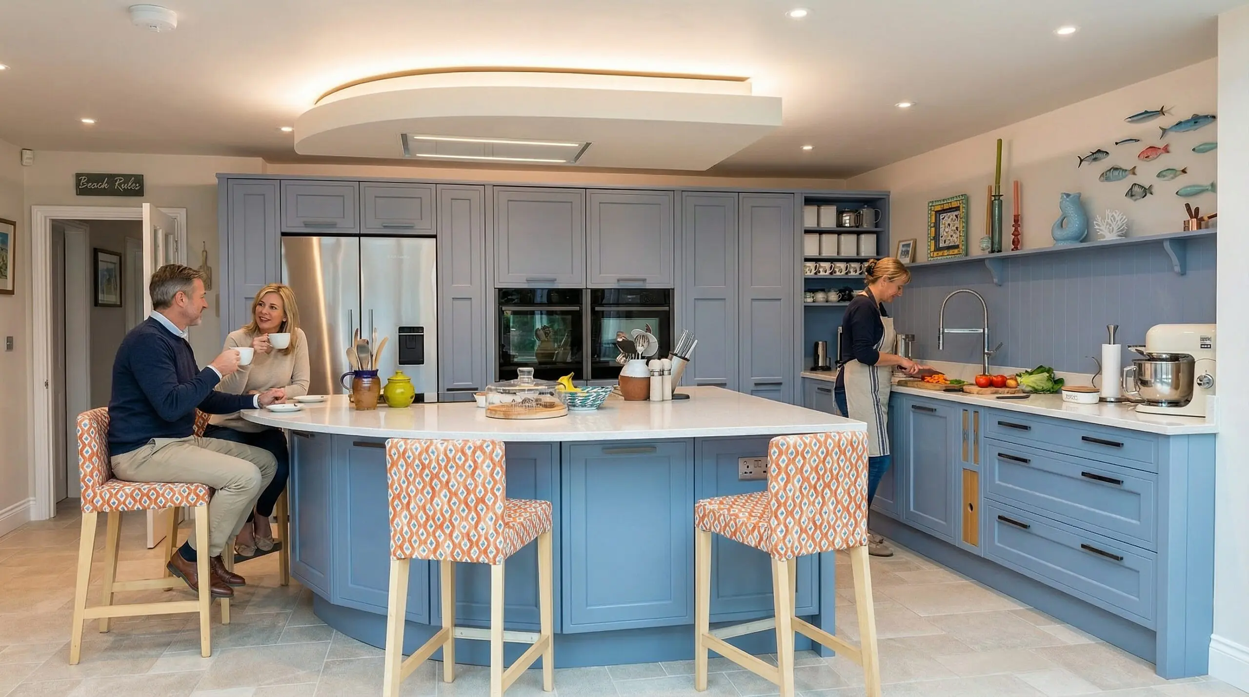 Bespoke kitchen with curved island and curved mood lighting with overhead ectractor built in